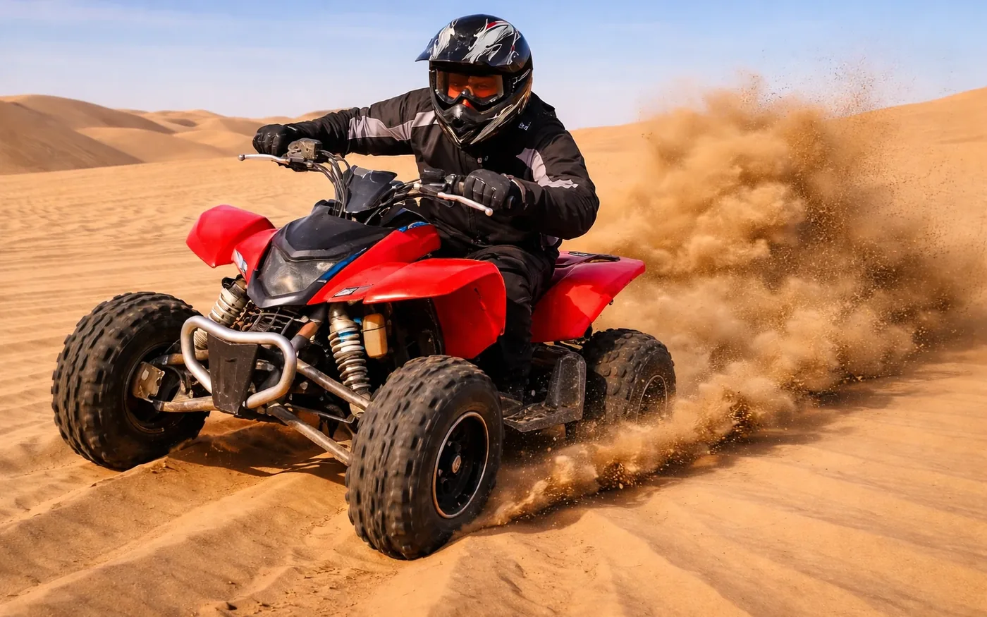 Morning desert safari Abu Dhabi with quad biking on red dunes at sunrise