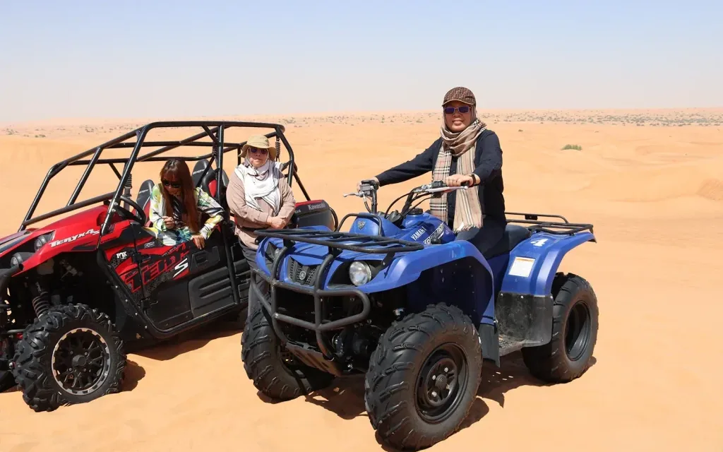 VIP desert safari Abu Dhabi with quad bike riding on red sand dunes