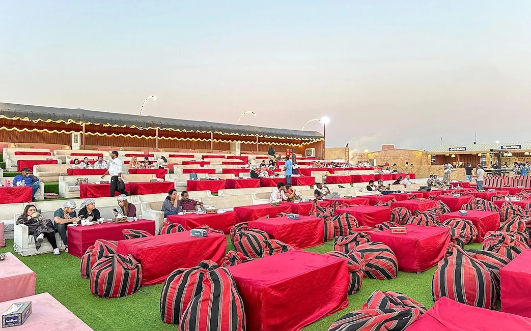 VIP desert safari Abu Dhabi with luxury camp lounge seating and dinner